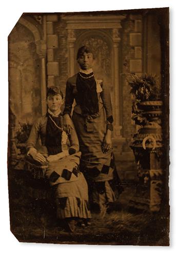 (PHOTOGRAPHY--EARLY AND CASED IMAGES.) Photograph of black and white seamstresses, apparently business partners (supplied title).